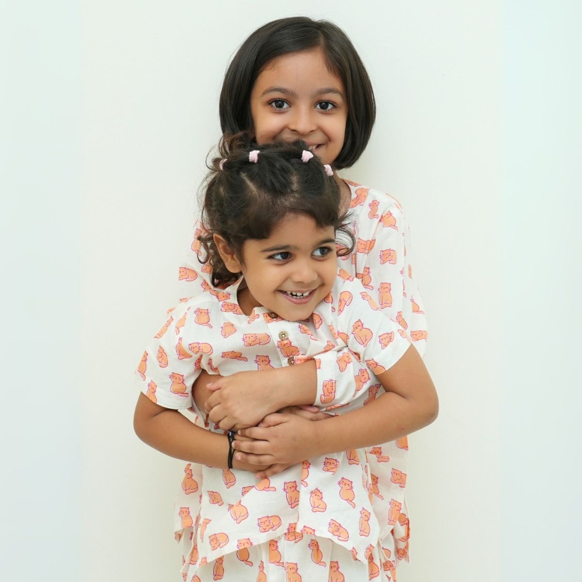 Meow Mornings PJ set night suit
Two young girls in matching dresses with a white background